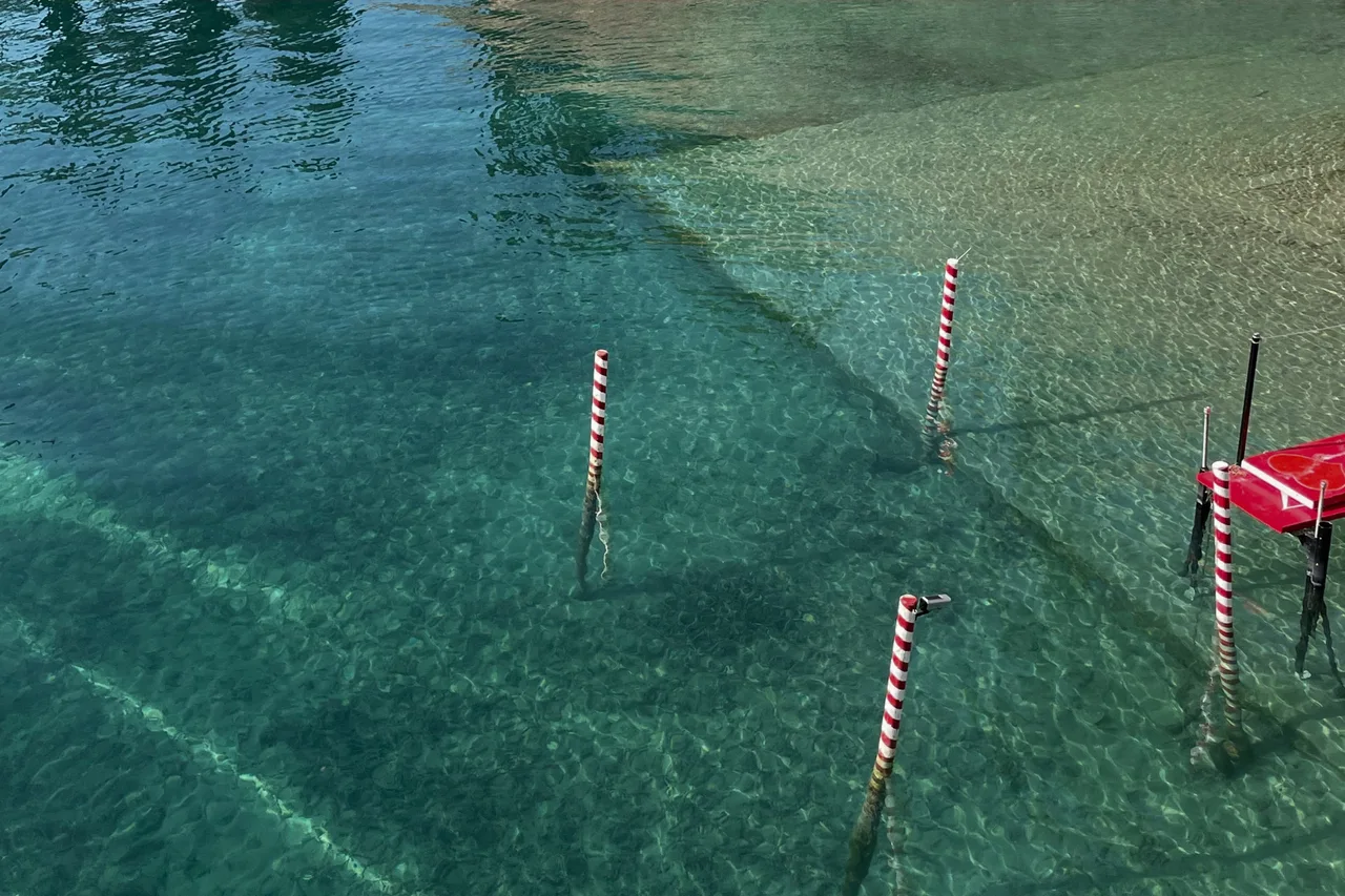 Clear green water at a lakeside lido