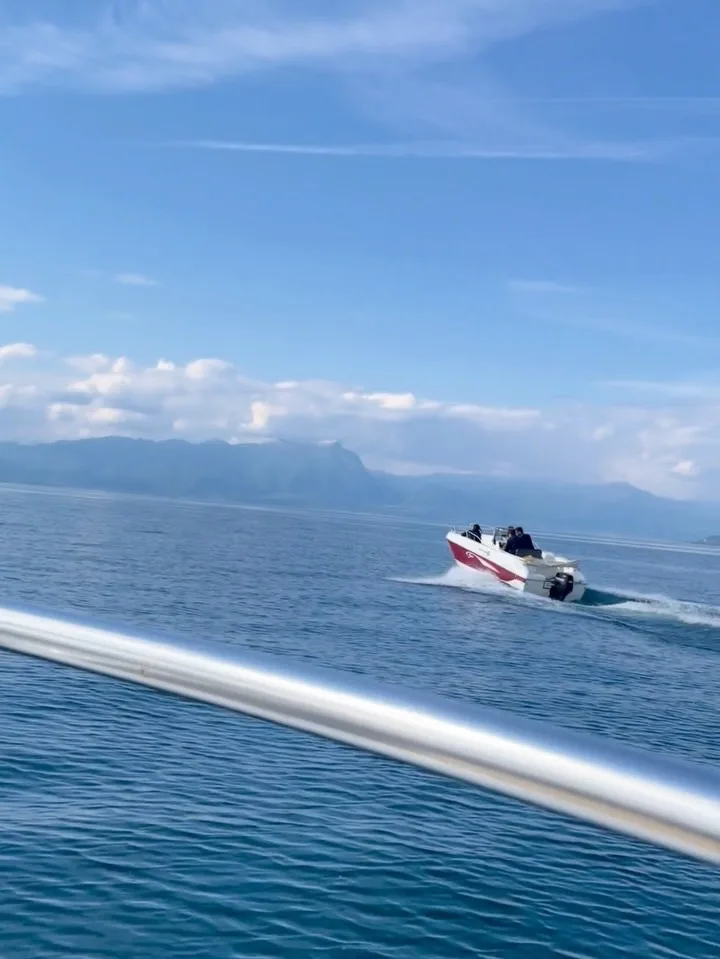 A motorboat crossing the lake